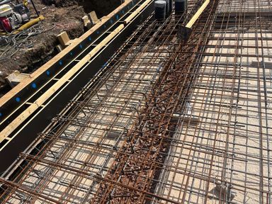Reinforcement mesh and ground beam cages fixed and ready for inspection before concreting