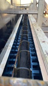 Reinforcement links and a void former inside a timber shuttered ground beam